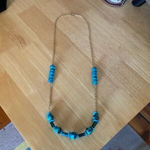 Beautiful ceramic and glass beaded necklace on gold over sterling marked chain.